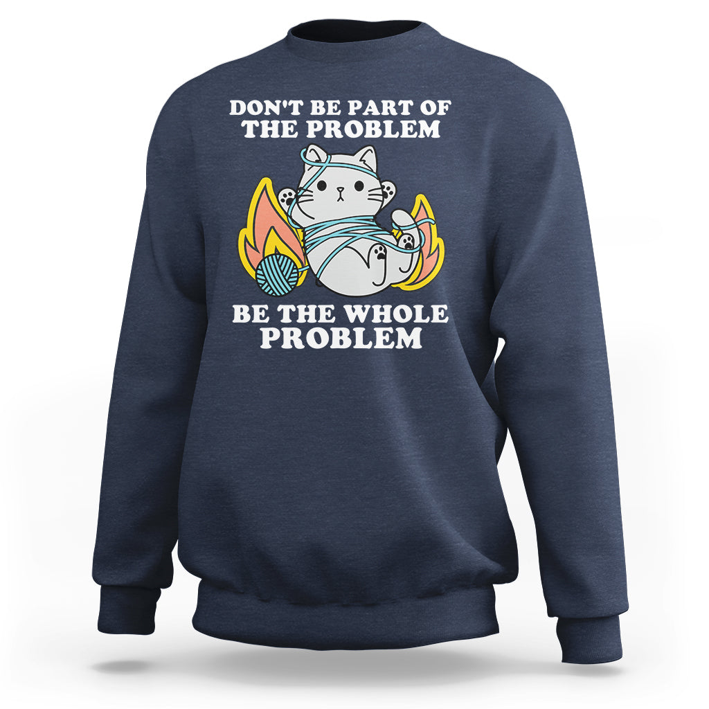 Navy crewneck sweatshirt with cat graphic and 'BE THE WHOLE PROBLEM' text