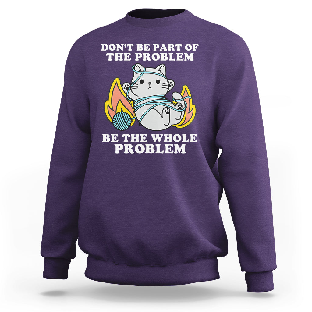 Purple crewneck sweatshirt with cat graphic and 'BE THE WHOLE PROBLEM' text