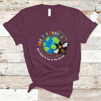 Maroon T-shirt with circular bee and globe graphic and slogan