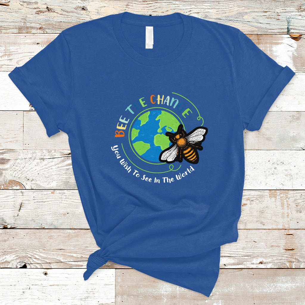 Royal blue T-shirt with circular bee and globe graphic and slogan