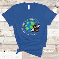 Royal blue T-shirt with circular bee and globe graphic and slogan