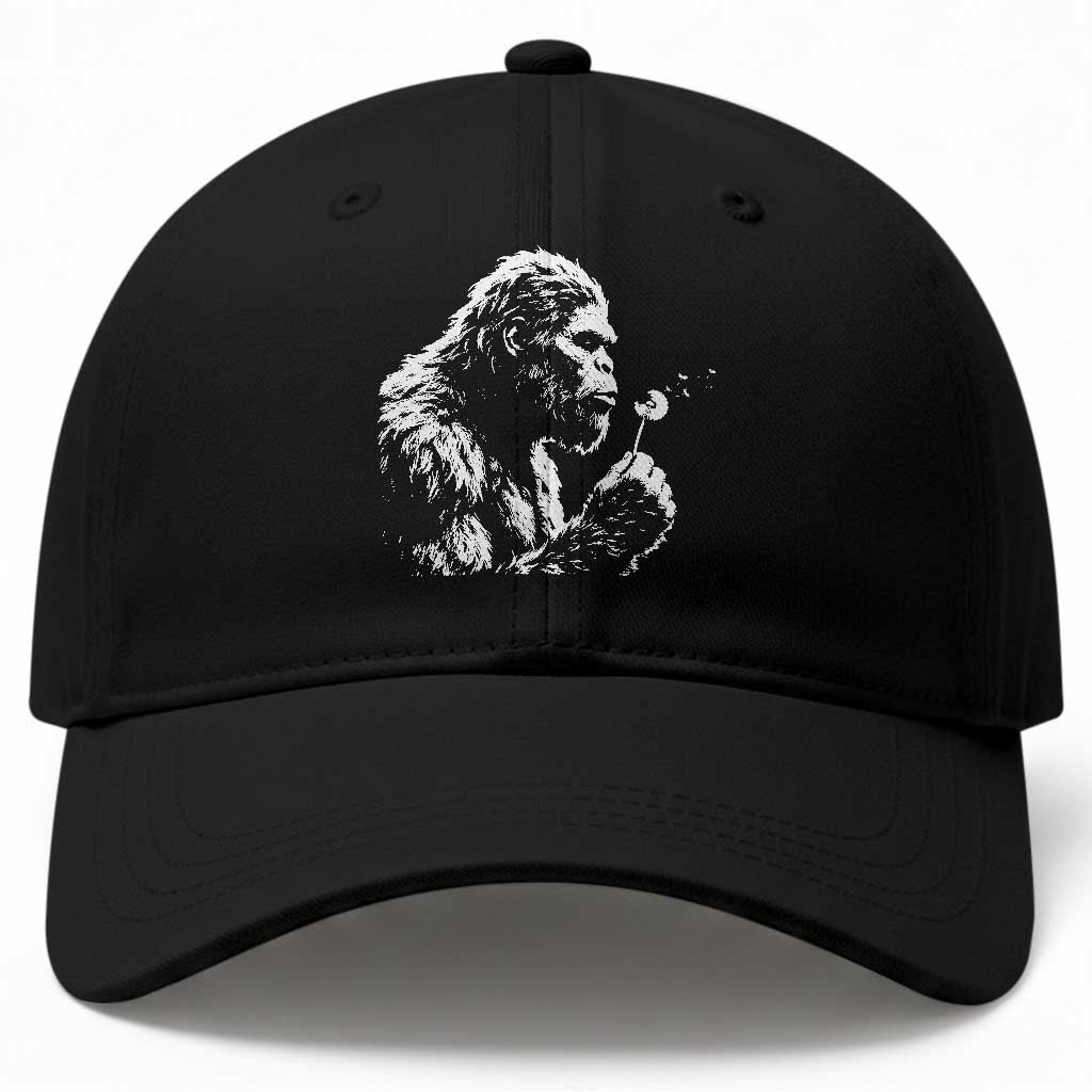 Bigfoot Blowing Dandelion Flower Graphic Baseball Cap Whimsical Sasquatch Profile Artistic Vintage Distressed