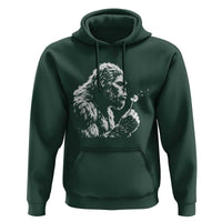 Bigfoot Blowing Dandelion Flower Graphic Hoodie Whimsical Sasquatch Profile Artistic Vintage Distressed