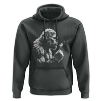 Bigfoot Blowing Dandelion Flower Graphic Hoodie Whimsical Sasquatch Profile Artistic Vintage Distressed