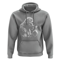 Bigfoot Blowing Dandelion Flower Graphic Hoodie Whimsical Sasquatch Profile Artistic Vintage Distressed