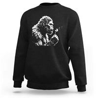 Bigfoot Blowing Dandelion Flower Graphic Sweatshirt Whimsical Sasquatch Profile Artistic Vintage Distressed