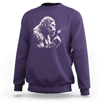 Bigfoot Blowing Dandelion Flower Graphic Sweatshirt Whimsical Sasquatch Profile Artistic Vintage Distressed