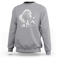 Bigfoot Blowing Dandelion Flower Graphic Sweatshirt Whimsical Sasquatch Profile Artistic Vintage Distressed