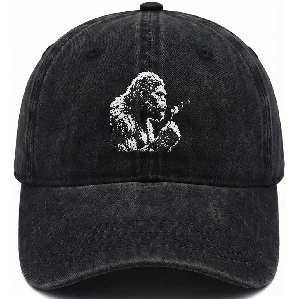 Bigfoot Blowing Dandelion Flower Graphic Washed Cotton Baseball Cap Whimsical Sasquatch Profile Artistic Vintage Distressed