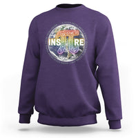 Purple crewneck sweatshirt with colorful math symbol graphic on chest