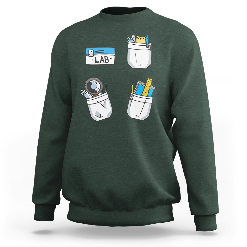 Dark forest green crewneck sweatshirt with lab tech graphic on front