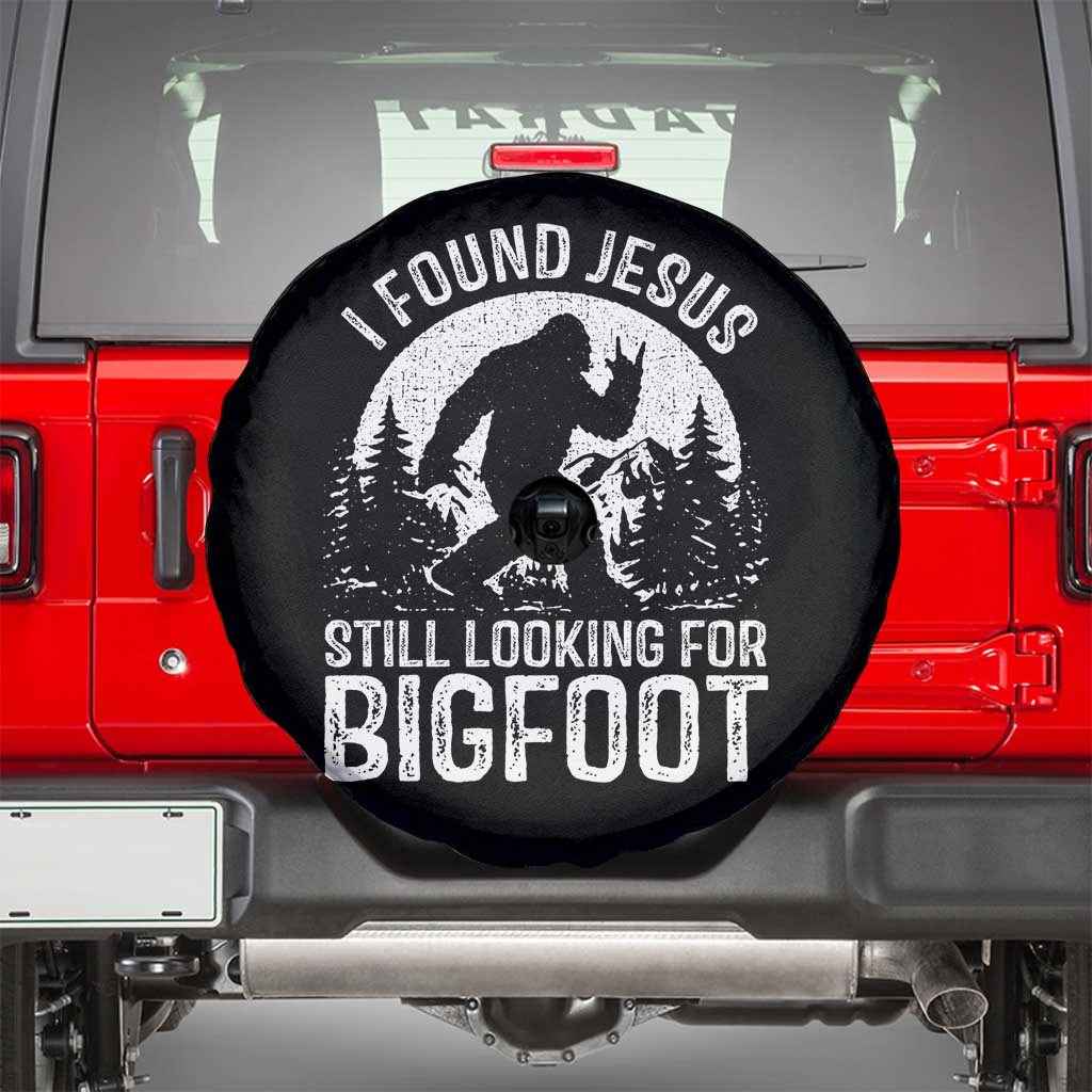 Funny Christian Sasquatch Spare Tire Cover I Found Jesus Still Looking for Bigfoot Vintage Distressed Graphic
