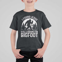 Funny Christian Sasquatch T Shirt For Kid I Found Jesus Still Looking for Bigfoot Vintage Distressed Graphic
