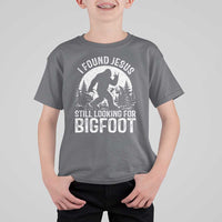 Funny Christian Sasquatch T Shirt For Kid I Found Jesus Still Looking for Bigfoot Vintage Distressed Graphic