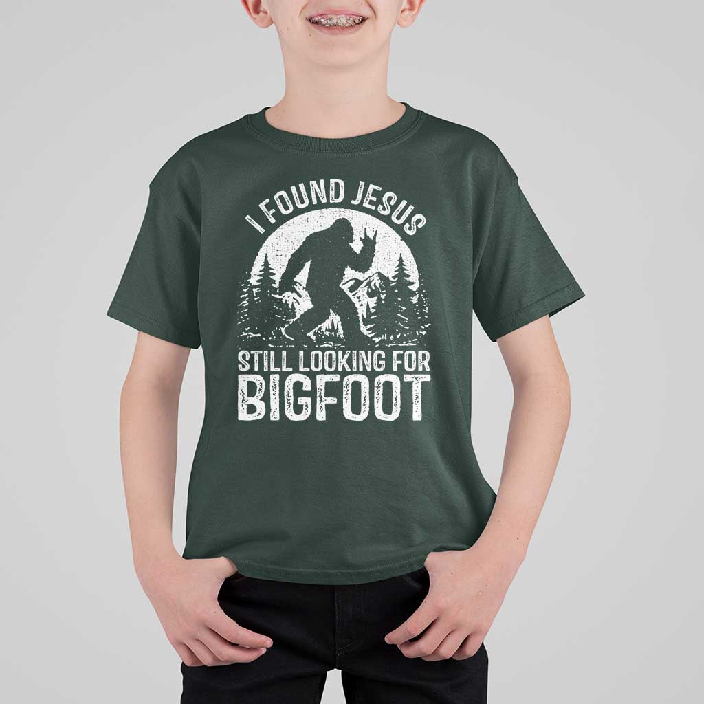 Funny Christian Sasquatch T Shirt For Kid I Found Jesus Still Looking for Bigfoot Vintage Distressed Graphic