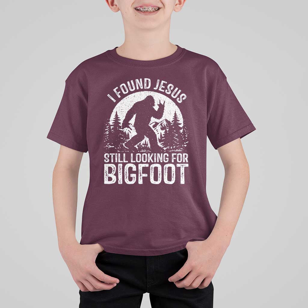 Funny Christian Sasquatch T Shirt For Kid I Found Jesus Still Looking for Bigfoot Vintage Distressed Graphic