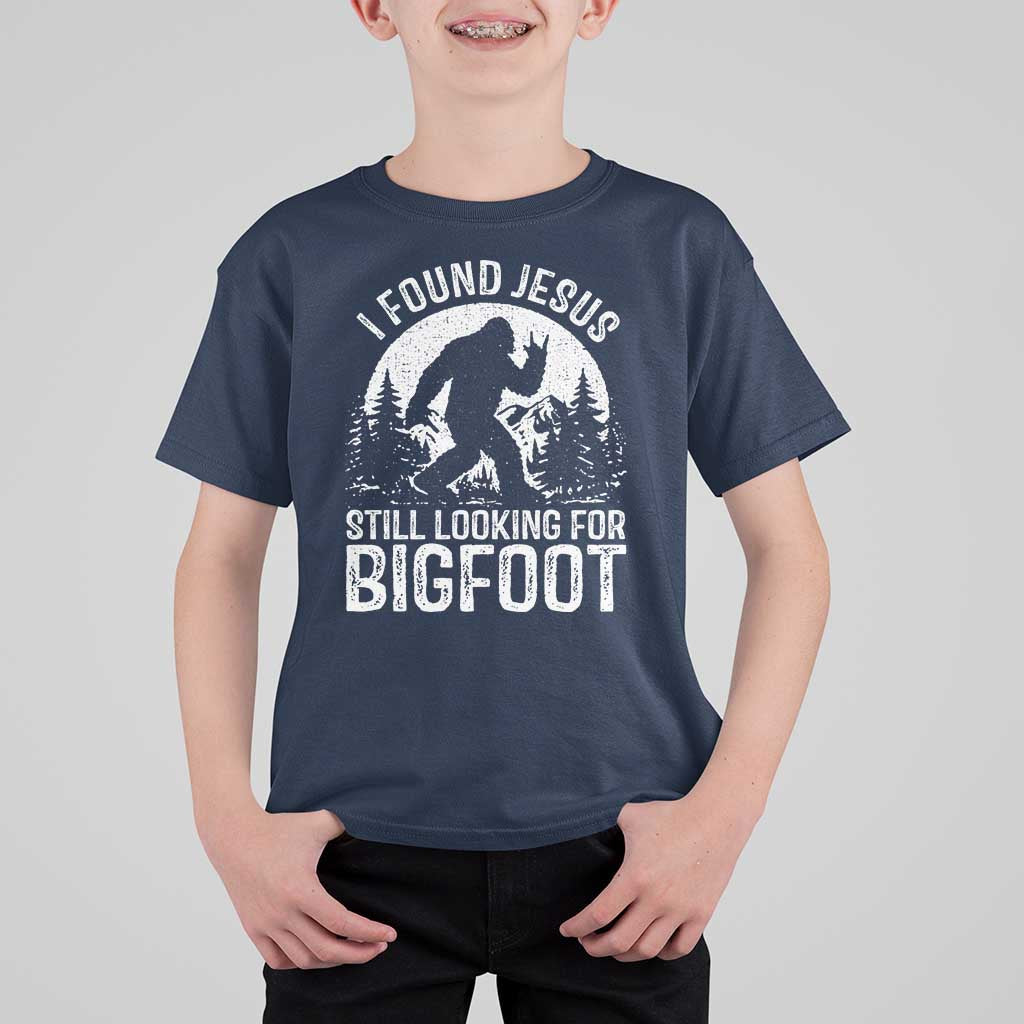 Funny Christian Sasquatch T Shirt For Kid I Found Jesus Still Looking for Bigfoot Vintage Distressed Graphic