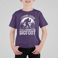 Funny Christian Sasquatch T Shirt For Kid I Found Jesus Still Looking for Bigfoot Vintage Distressed Graphic