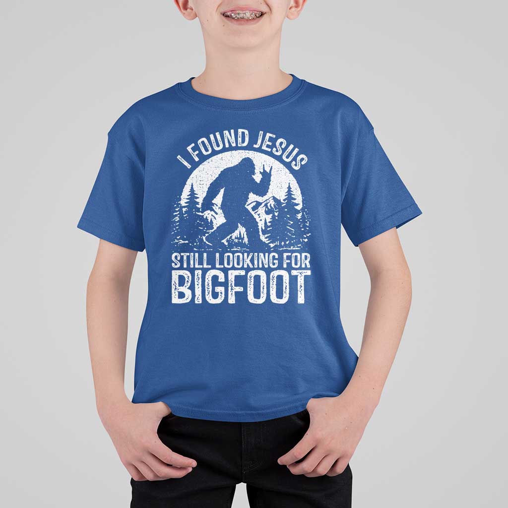 Funny Christian Sasquatch T Shirt For Kid I Found Jesus Still Looking for Bigfoot Vintage Distressed Graphic