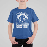 Funny Christian Sasquatch T Shirt For Kid I Found Jesus Still Looking for Bigfoot Vintage Distressed Graphic