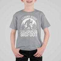 Funny Christian Sasquatch T Shirt For Kid I Found Jesus Still Looking for Bigfoot Vintage Distressed Graphic