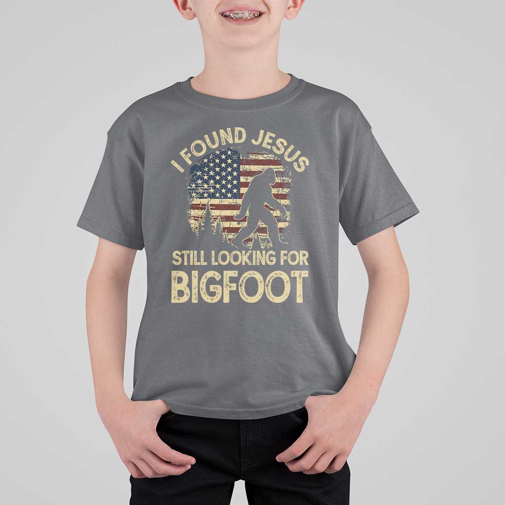 I Found Jesus Still Looking for Bigfoot Patriotic T Shirt For Kid American Flag Christian Religious Sasquatch Vintage