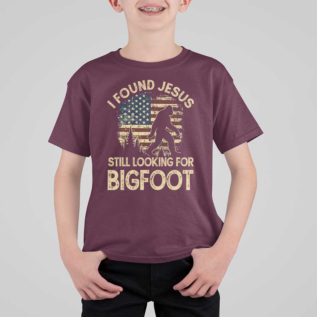 I Found Jesus Still Looking for Bigfoot Patriotic T Shirt For Kid American Flag Christian Religious Sasquatch Vintage