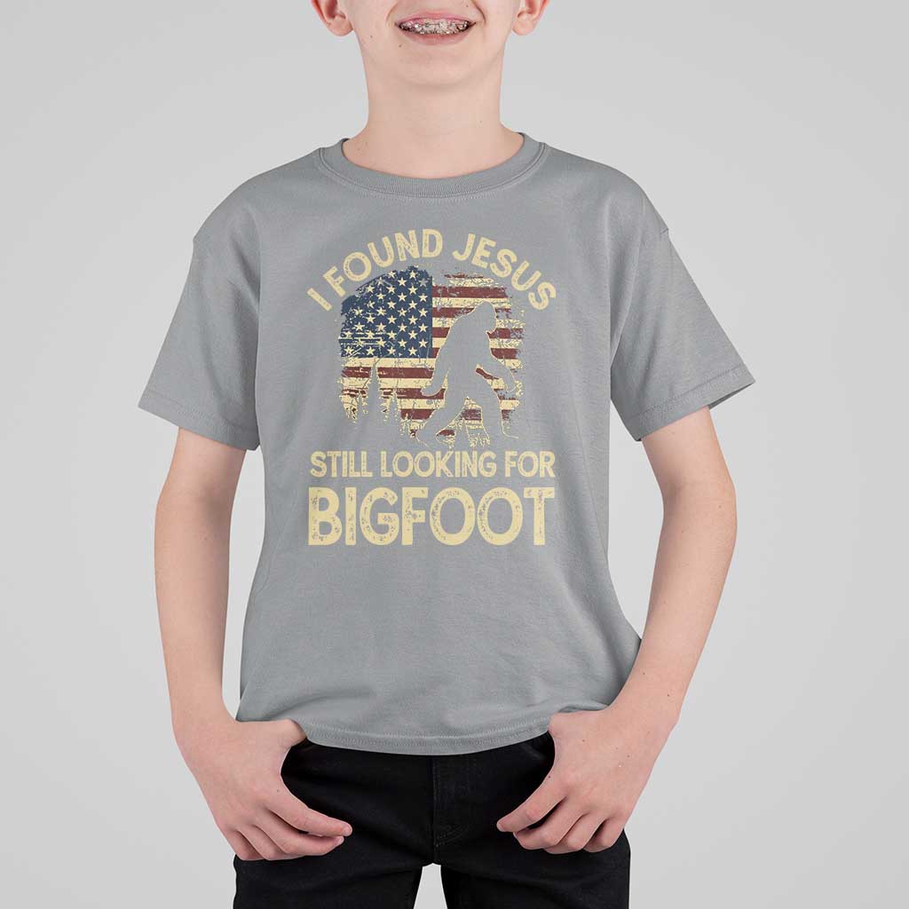 I Found Jesus Still Looking for Bigfoot Patriotic T Shirt For Kid American Flag Christian Religious Sasquatch Vintage