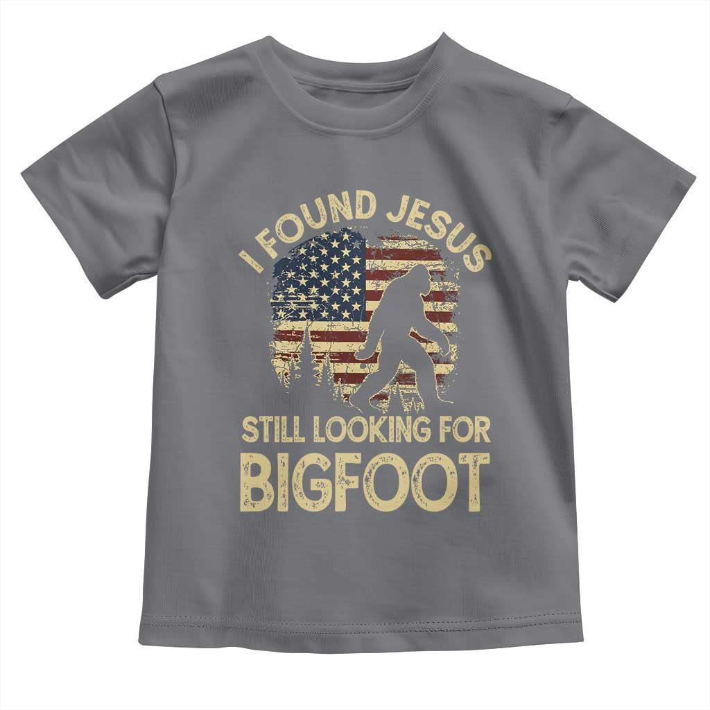 I Found Jesus Still Looking for Bigfoot Patriotic Toddler T Shirt American Flag Christian Religious Sasquatch Vintage