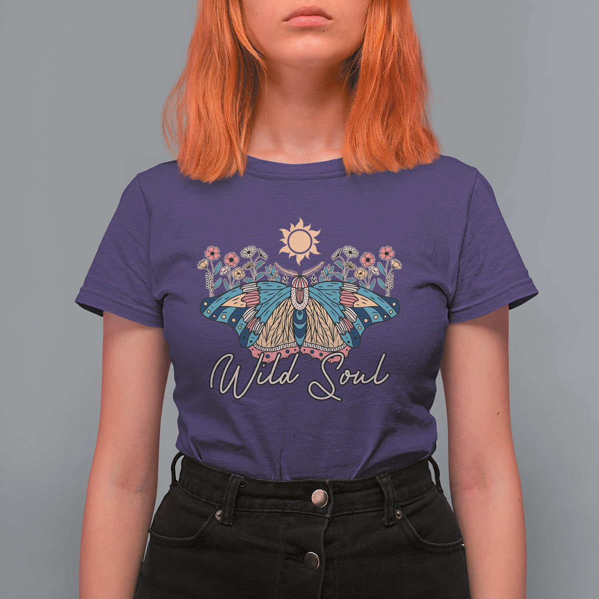 Women's purple graphic t-shirt with colorful moth, sun, and 'Wild Soul' print