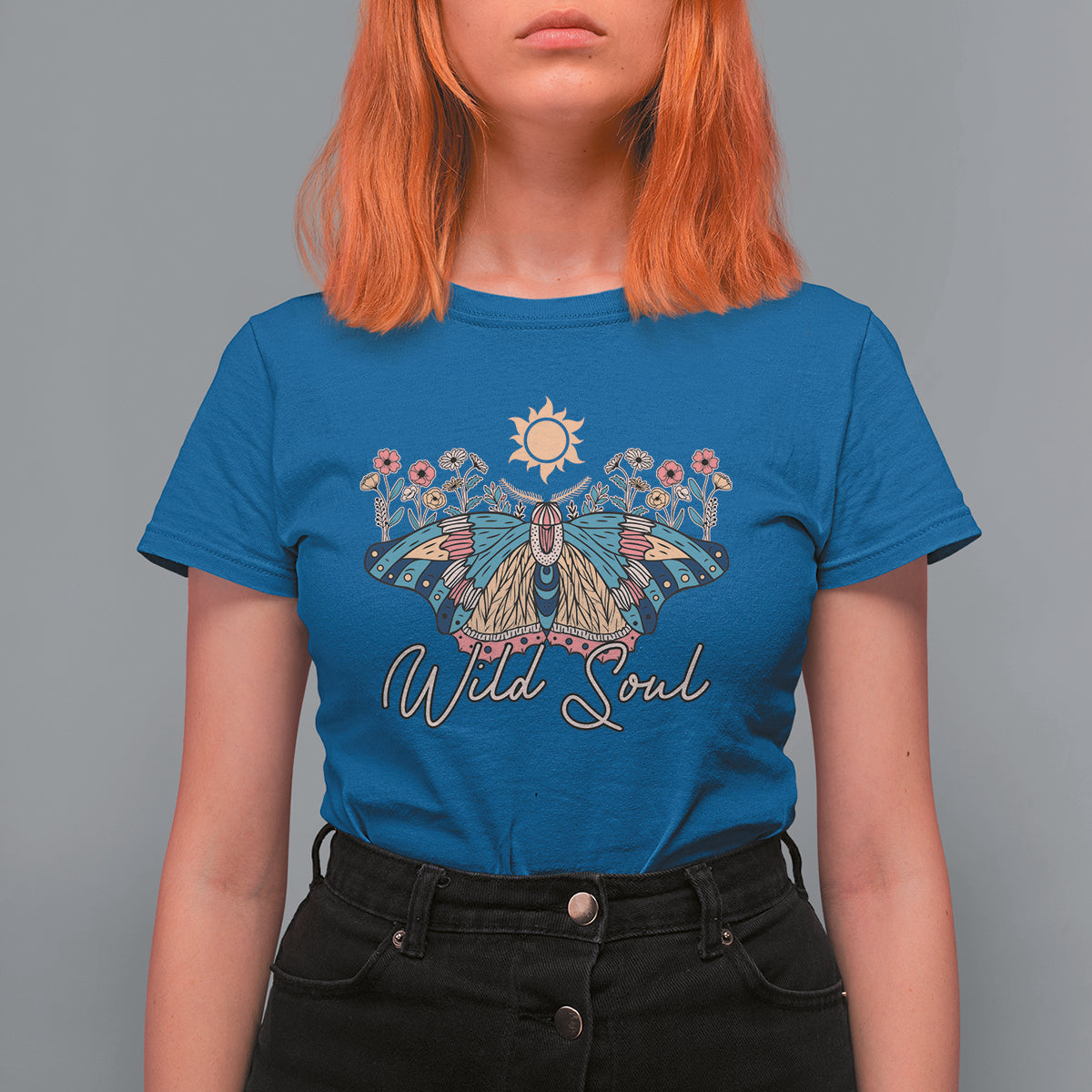 Women's royal blue graphic t-shirt with colorful moth, sun, and 'Wild Soul' print