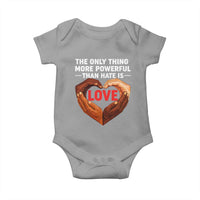 The Only Thing More Powerful Than Hate Is Love Baby Onesie Heart in Hands Unity Bunny Inspirational Quote