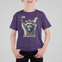 Funny America Raccoon Happy 4th of July T Shirt For Kid Holding Hotdog and US Flag Patriotic Graphic