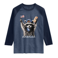 Funny America Raccoon Happy 4th of July Raglan Shirt Holding Hotdog and US Flag Patriotic Graphic