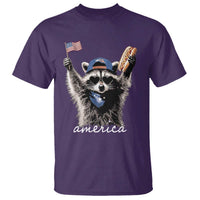 Funny America Raccoon Happy 4th of July T Shirt Holding Hotdog and US Flag Patriotic Graphic