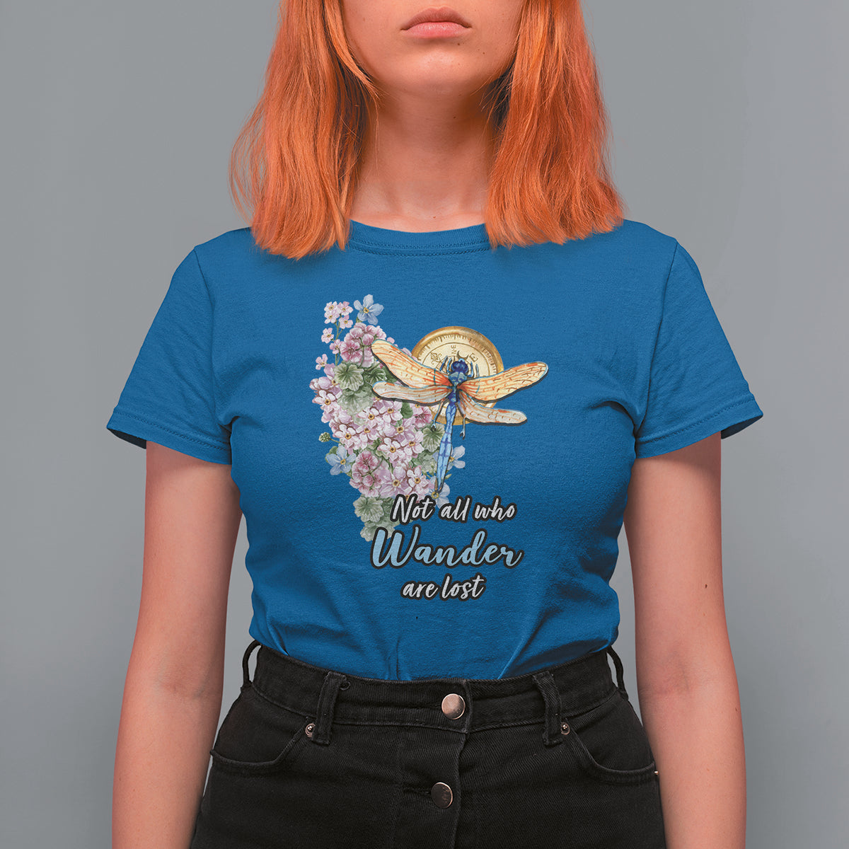 Women’s royal blue T-shirt with dragonfly and pink floral “Not all who Wander are lost” print