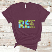 Maroon crew-neck T-shirt with colorful recycle, use new, think graphic on front.