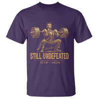 Funny Abraham Lincoln Squatting Barbell Semiquincentennial T Shirt Still Undefeated 1776 to 2026 Muscular President Gym Bodybuilder
