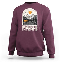 Maroon camping sweatshirt with front graphic reading "Camping Is Intents"