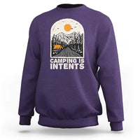 Purple camping sweatshirt with front graphic reading "Camping Is Intents"