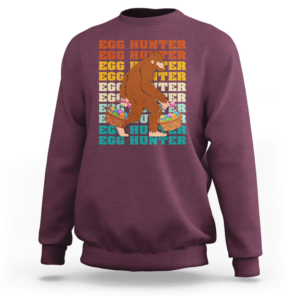 Kids long-sleeve crewneck sweatshirt, maroon; Bigfoot egg hunter graphic with baskets