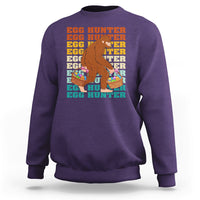 Kids long-sleeve crewneck sweatshirt, purple; Bigfoot egg hunter graphic with baskets