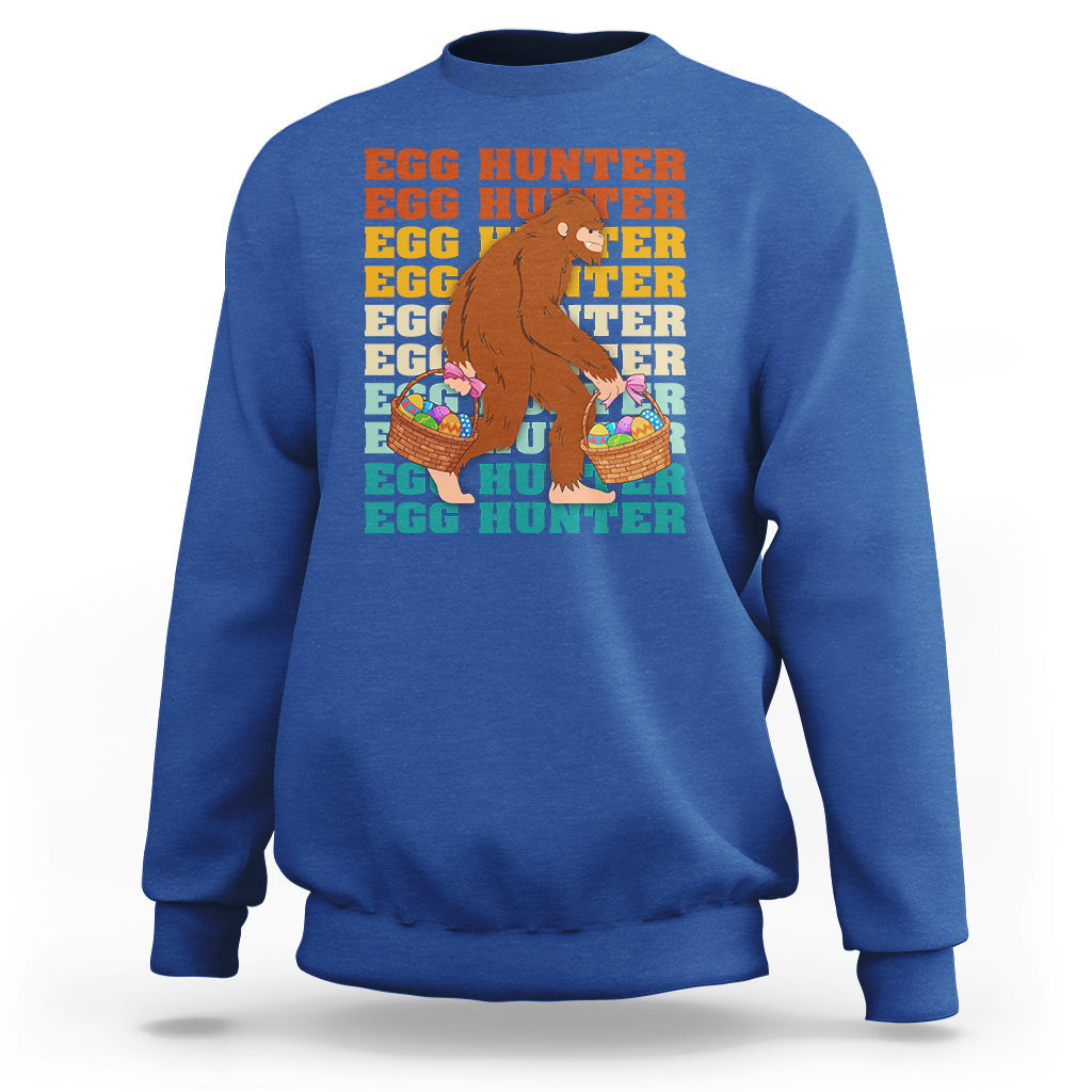 Kids long-sleeve crewneck sweatshirt, royal blue; Bigfoot egg hunter graphic with baskets