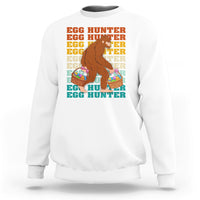 Kids long-sleeve crewneck sweatshirt, white; Bigfoot egg hunter graphic with baskets