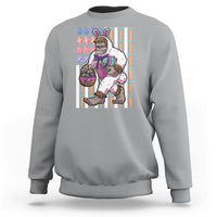 Kids sport gray sweatshirt with Bigfoot in bunny costume holding Easter eggs graphic