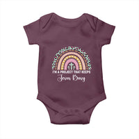 ’m a Project That Keeps Jesus Busy Rainbow Cross Baby Onesie Cute Christian Faith Humor