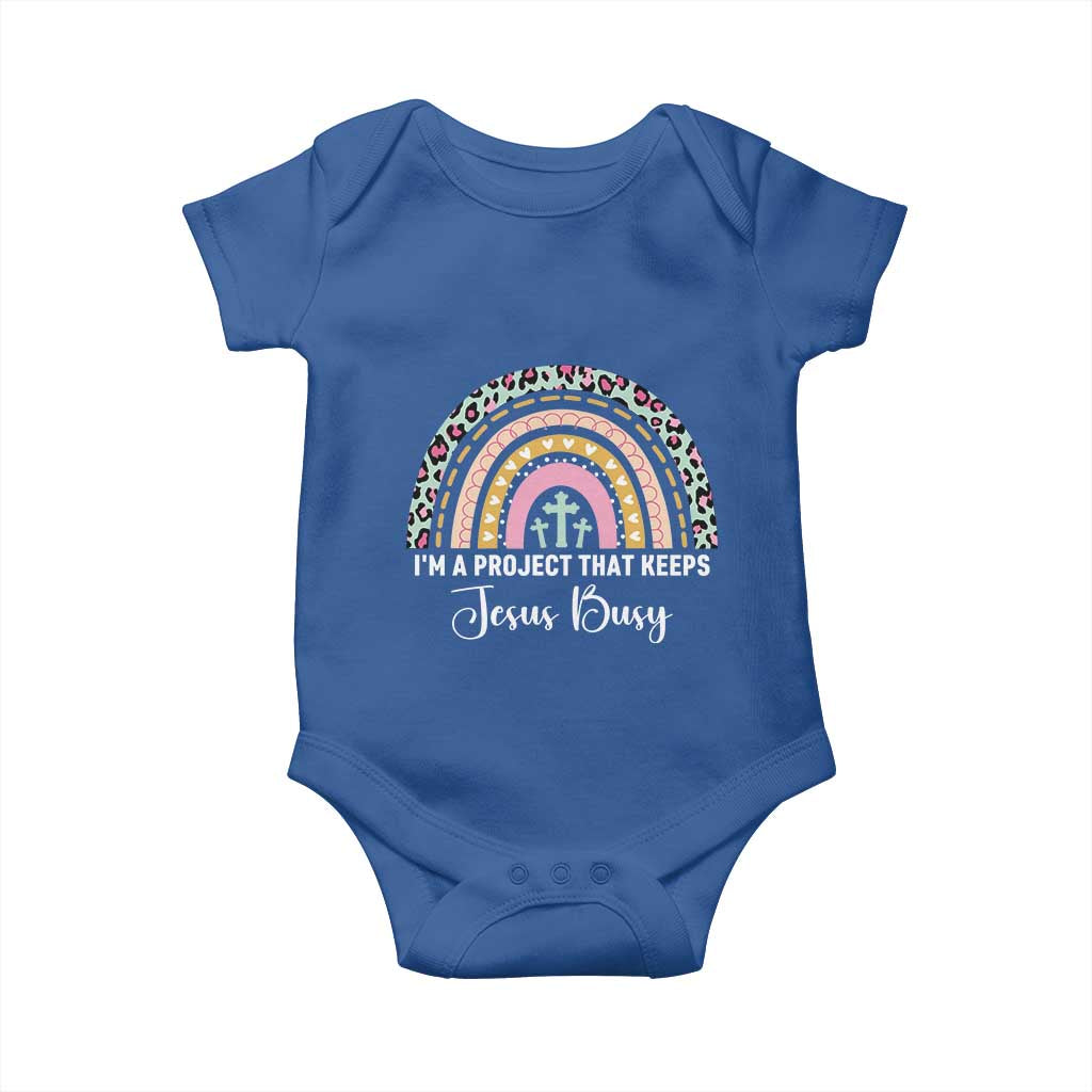 ’m a Project That Keeps Jesus Busy Rainbow Cross Baby Onesie Cute Christian Faith Humor