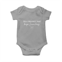 I’m a Project That Keeps Jesus Busy Coquette Bow Baby Onesie Christian Faith Humor