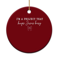 I am a Project That Keeps Jesus Busy Coquette Bow Ceramic Ornament Christian Faith Humor