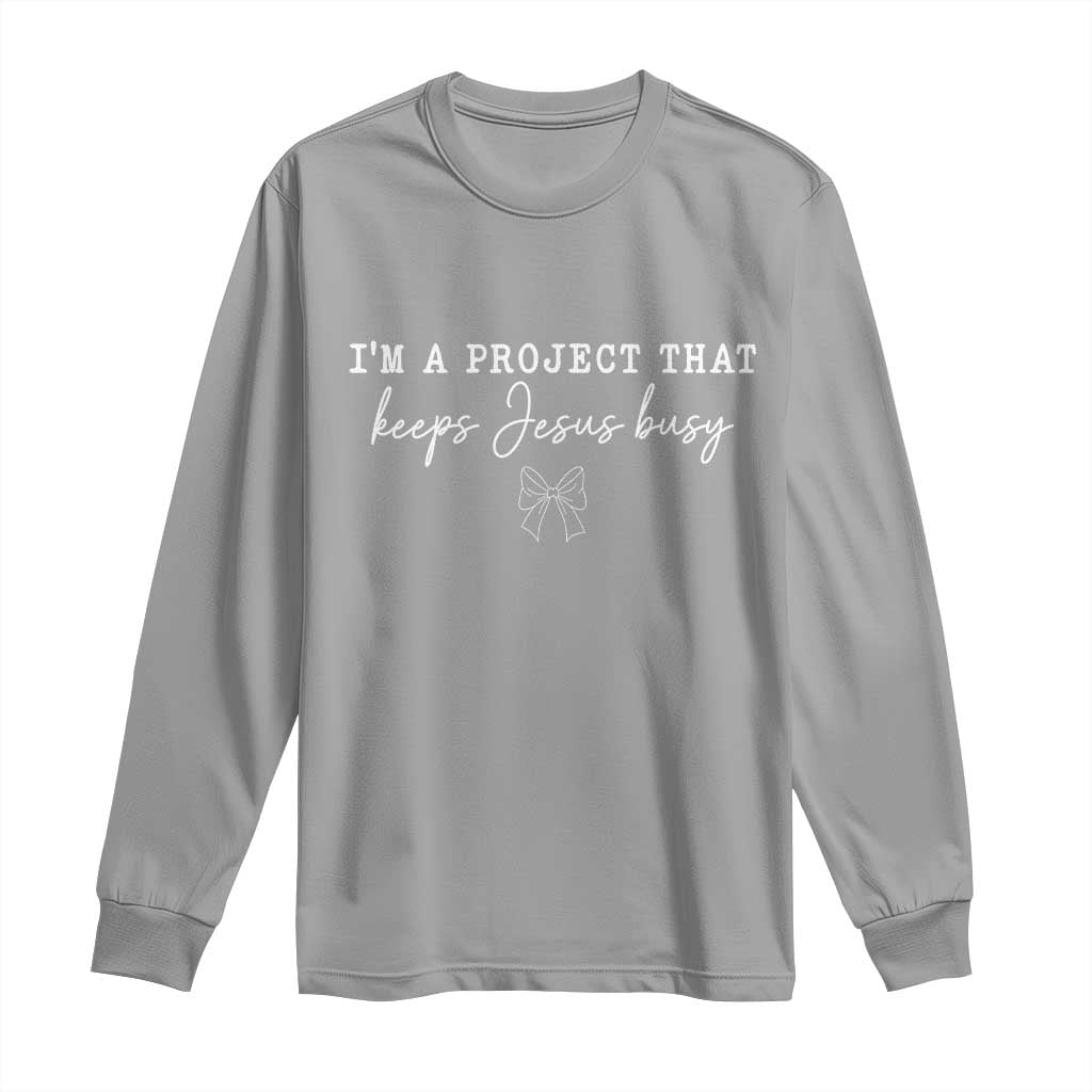 I’m a Project That Keeps Jesus Busy Coquette Bow Long Sleeve Shirt Christian Faith Humor